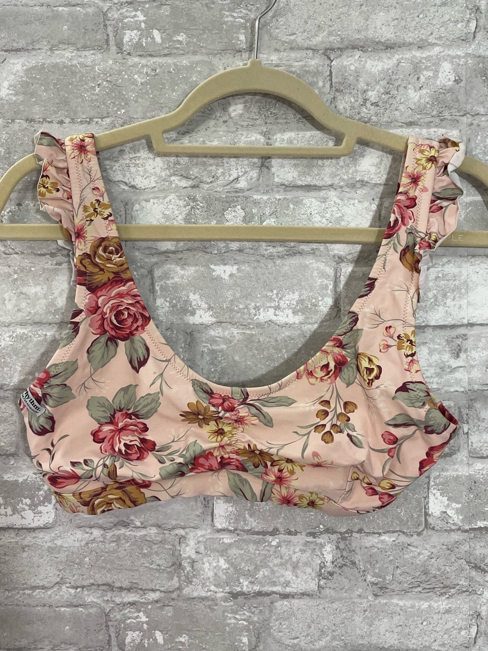Rhythm brand bikini top in a soft pink floral print with ruffled shoulder